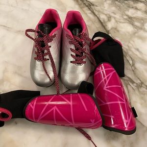 Set of girls soccer cleats and shin guards